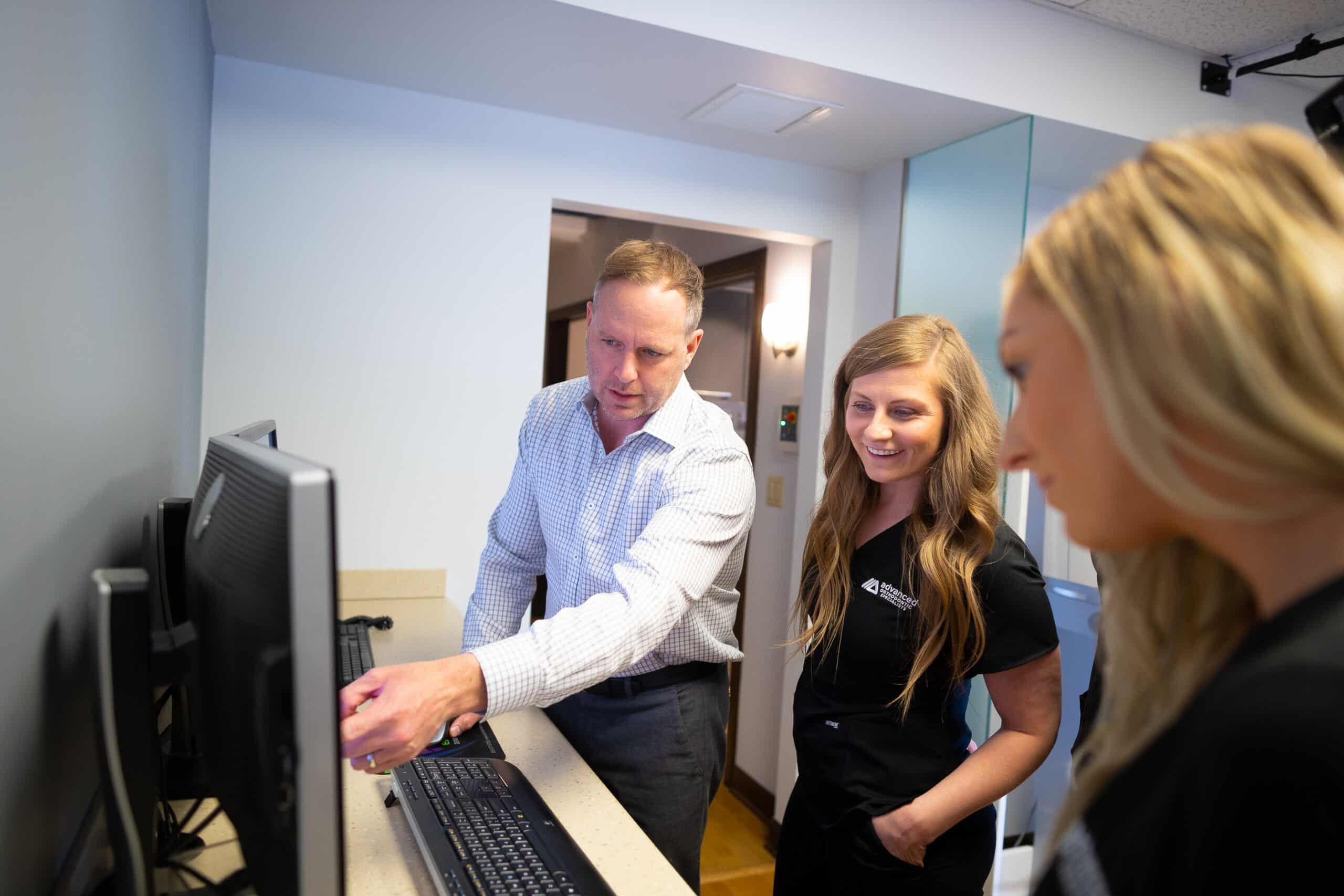 Dr Michael Bicknell Explaining To A Patient